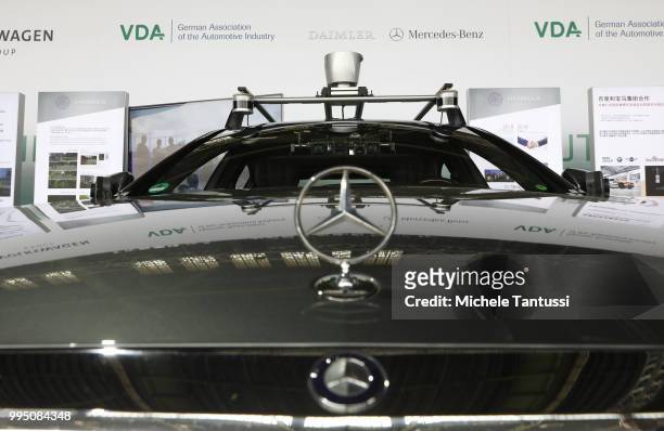 Cameras and gps navigation system gear are placed on a self driving Mercedes car on display at an event to present a project on autonomous driving at...