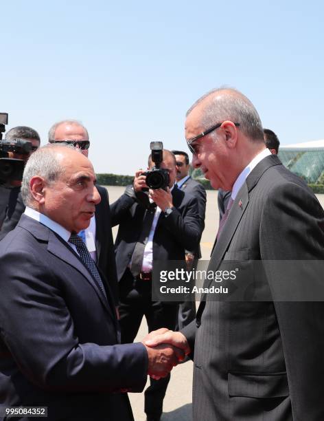 Turkish President Recep Tayyip Erdogan is being welcomed by Azerbaijani First Deputy Prime Minister Yaqub Eyyubov as he arrives with the private...