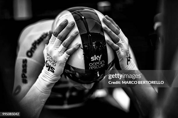 Great Britain's Christopher Froome concentrates prior to taking the start of the third stage of the 105th edition of the Tour de France cycling race,...