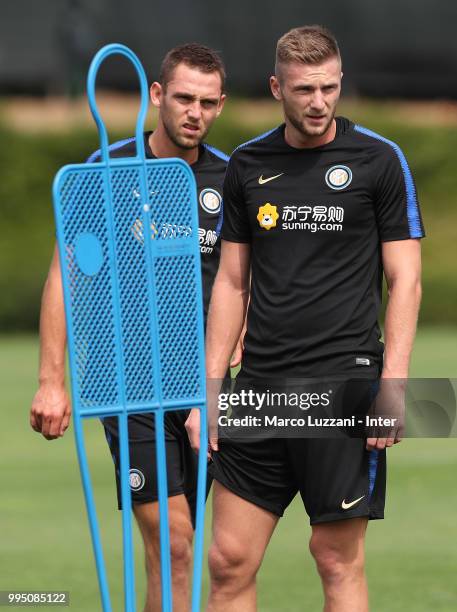 Milan Skriniar and Stefan De Vrij of FC Internazionale look on during the FC Internazionale training session at the club's training ground Suning...