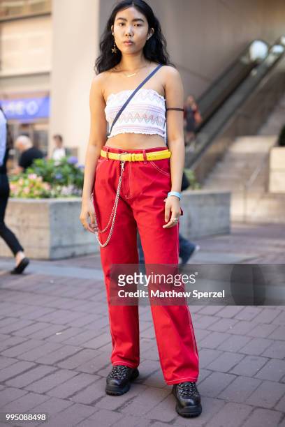 Sharena Chindavong is seen on the street attending Men's New York Fashion Week wearing Forever 21, Dickies, thrifted belt on July 9, 2018 in New York...