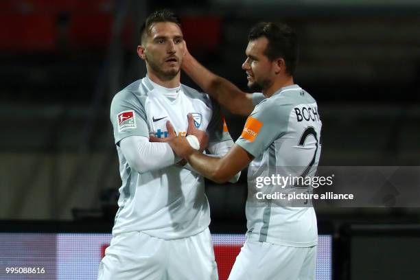 Dimitrios Diamantakos of VfL Bochum celebrates his goal for 0:1 with teammate Kevin Stoeger during the German 2nd Bundesliga football match between...