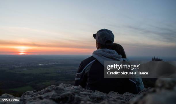 Sebastian and his girlfriend sitting near Hohenzollern Castle watching the sunset near Hechingen, Germany, 21 September 2017. Photo: Sebastian...