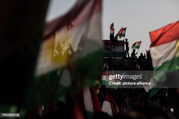 People listen to a speech of Kurdish President Masoud Barzani during a rally for an independent Kurdistan in Erbil, Iraq, 22 September 2017. Erbil is...