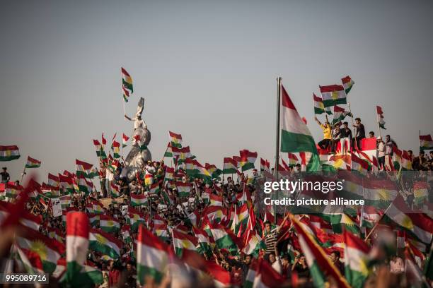 Dpatop - People listen to a speech of Kurdish President Masoud Barzani during a rally for an independent Kurdistan in Erbil, Iraq, 22 September 2017....