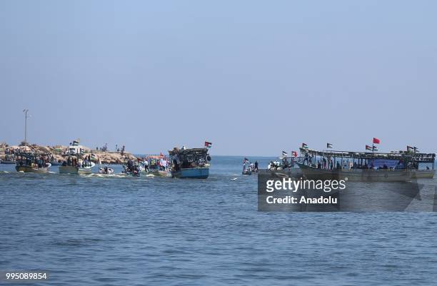 Palestinians are seen on boats to set out from the Gaza Strip on Tuesday in hopes of breaking an 11-year Israeli blockade on the coastal enclave in...
