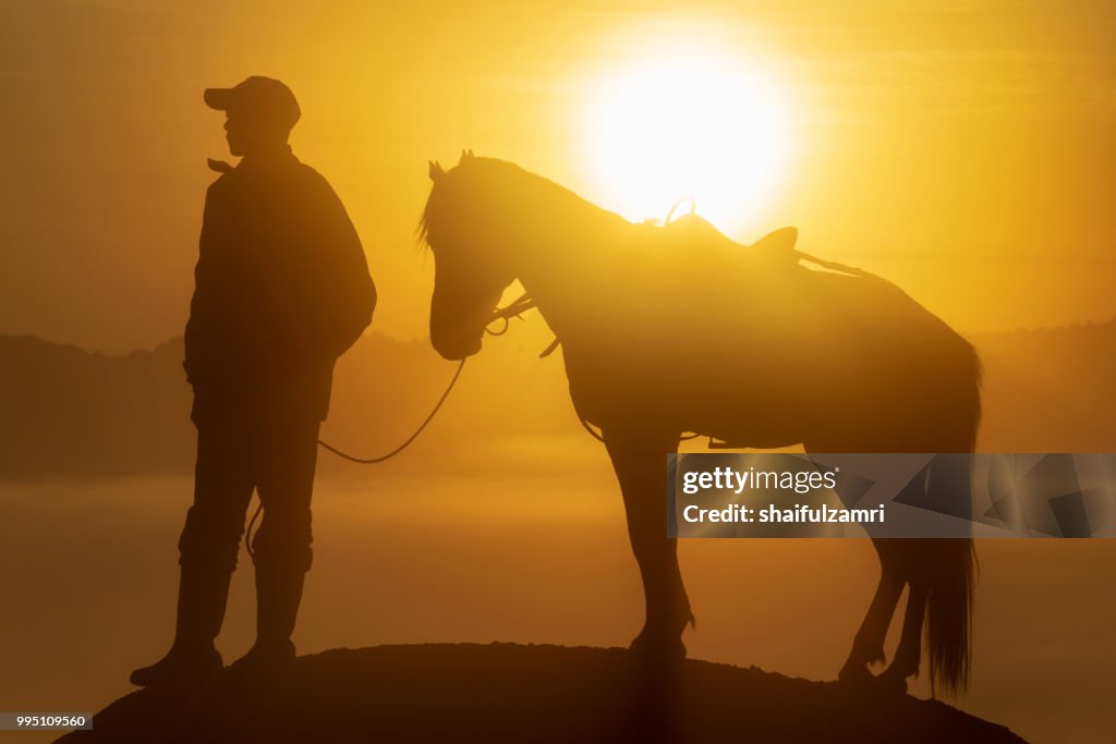 Unidentified local people or Bromo Horseman at the mountainside of Mount Bromo, Semeru, Tengger National Park, East Java of Indonesia.