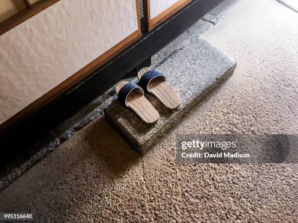 slippers outside room in japanese ryokan - fusuma doors stock pictures, royalty-free photos & images