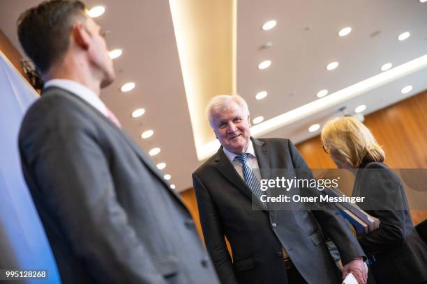 German Interior Minister Horst Seehofer leaves after presenting his "master plan" concerning migration policy on July 10, 2018 in Berlin, Germany....