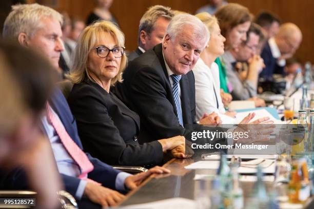 German Interior Minister Horst Seehofer presents his "master plan" concerning migration policy on July 10, 2018 in Berlin, Germany. The plan includes...