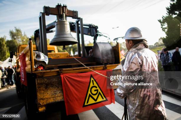 An employee wears his protective suit during a protest against the steel fusion plans of Thyssenkrupp with the Indian Tata group, organised by the...