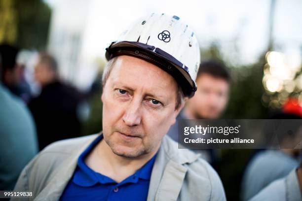 Bernd Langer, employee of Thyssenkrupp, participates in a protest against the steel fusion plans of Thyssenkrupp with the Indian Tata group,...