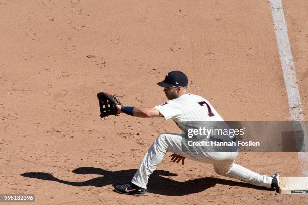 Joe Mauer of the Minnesota Twins makes a play at first base against the Baltimore Orioles during the game on July 7, 2018 at Target Field in...