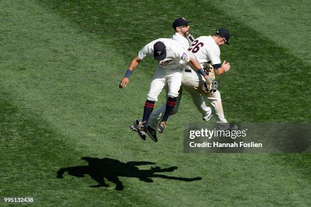 Eddie Rosario, Jake Cave and Max Kepler of the Minnesota Twins celebrate defeating the Baltimore Orioles after the game on July 7, 2018 at Target...