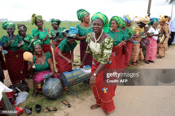 Women dance to celebrate Nigerian President Goodluck Jonathan 's arrival in Port Harcourt on May 14, 2010. President Jonathan who is making his first...