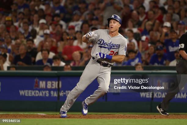 Chase Utley of the Los Angeles Dodgers stops at first base on his single during the fifth inning of the MLB game against the Los Angeles Angels of...