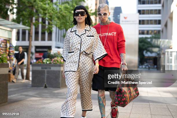 Michelle Song and Chris Lavish are seen on the street attending Men's New York Fashion Week on July 9, 2018 in New York City.