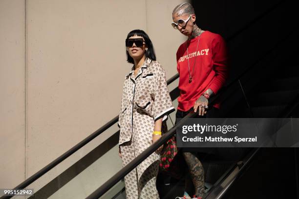 Michelle Song and Chris Lavish are seen on the street attending Men's New York Fashion Week on July 9, 2018 in New York City.