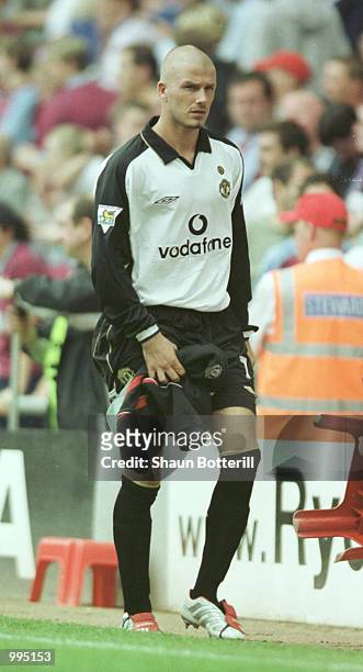 David Beckham of Manchester United leaves the field with an injury during the Barclaycard FA Premiership match between Aston Villa and Manchester...