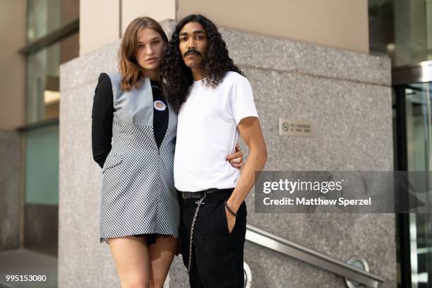 Paige Bitner and Yaya Outlaw are seen on the street attending Men's New York Fashion Week wearing Craig Green, Comme des Garcon, PS Kaufman on July...