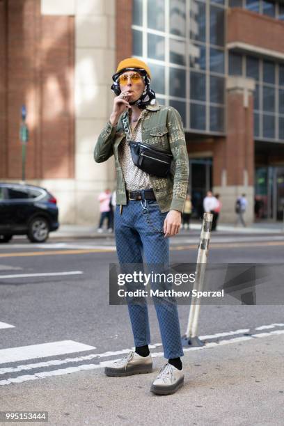 John Dunham is seen on the street attending Men's New York Fashion Week wearing Hysteric Glamour shirt, Opening Ceremony, Huf belt, Dolce & Gabbana...