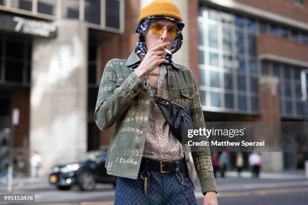 John Dunham is seen on the street attending Men's New York Fashion Week wearing Hysteric Glamour shirt, Opening Ceremony, Huf belt, Dolce & Gabbana...