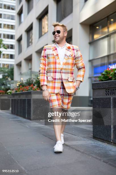 Andrew Werner is seen on the street attending Men's New York Fashion Week wearing Mr. Turk suit with Fleurd Pins on July 9, 2018 in New York City.