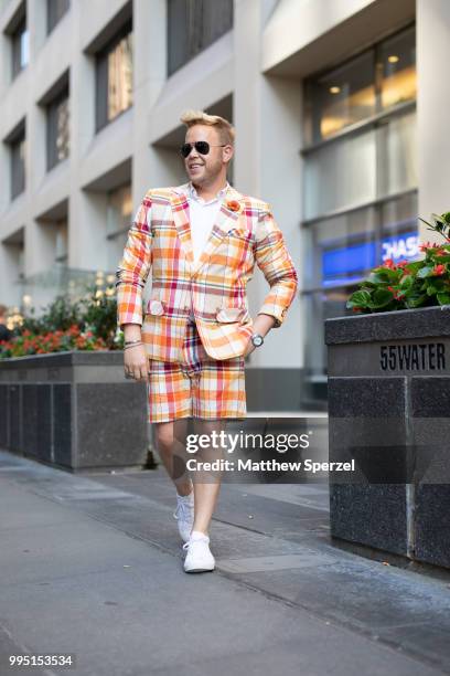 Andrew Werner is seen on the street attending Men's New York Fashion Week wearing Mr. Turk suit with Fleurd Pins on July 9, 2018 in New York City.