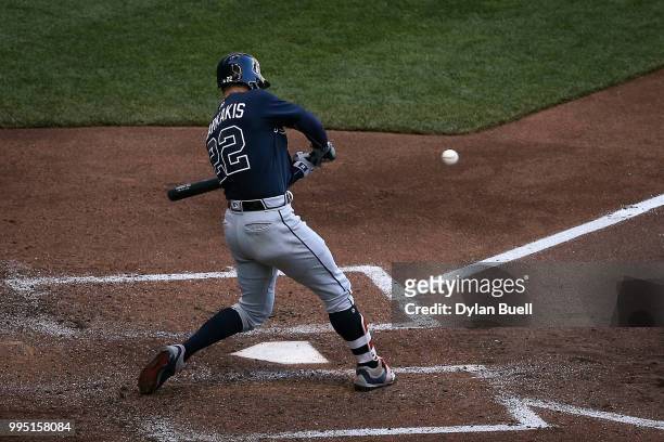 Nick Markakis of the Atlanta Braves lines out in the fifth inning against the Milwaukee Brewers at Miller Park on July 7, 2018 in Milwaukee,...