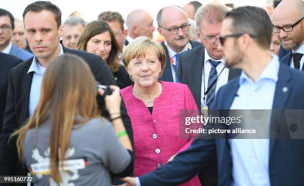 German Chancellor Angela Merkel , attends an election campaign event of the CDU party together with CDU secretary general Peter Tauber and the member...