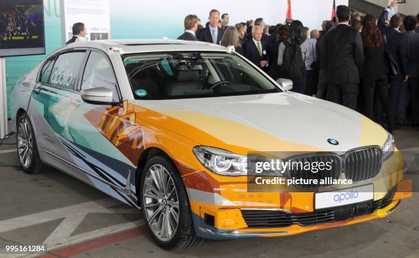 July 2018, Germany, Berlin: A BMW, which is equipped with the autonomous platform Apollo of the Chinese company Baidu, during a presentation for...