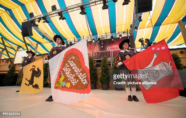 Flag bearers stand on stage during the opening ceremony of the 172nd Cannstatter folk festival in Stuttgart, Germany, 22 September 2017. The...