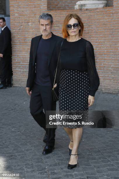 Renato De Maria and Isabella Ferrari attend the funeral for Carlo Vanzina at Santa Maria degli Angeli on July 10, 2018 in Rome, Italy.