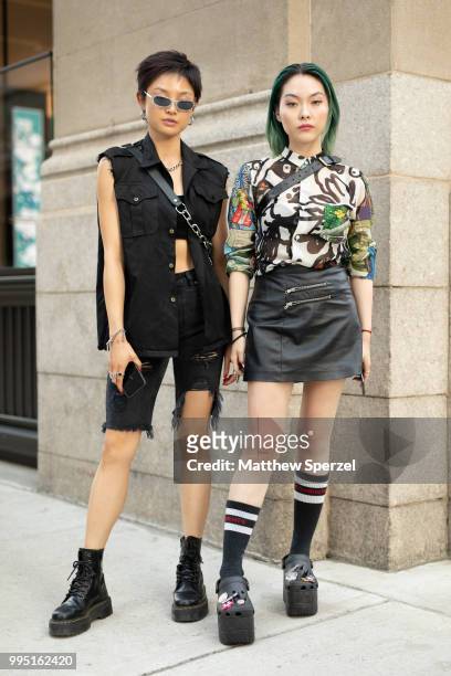 Rika Konishi and Joyce are seen on the street attending Men's New York Fashion Week wearing CDG Homme, Vetements, Balenciaga; vintage Alexander Wang,...