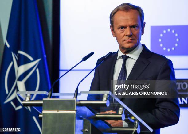 European Council President Donald Tusk holds a joint press conference after signing a joint declaration on the NATO-EU cooperation, in Brussels, on...