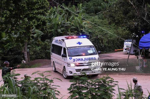 Ambulances leave the Tham Luang cave area as operations continue for those still trapped inside the cave in Khun Nam Nang Non Forest Park in the Mae...