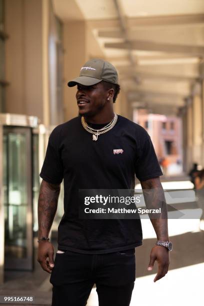 Corey Clement is seen on the street attending Men's New York Fashion Week wearing all-black with cap and gold chain on July 9, 2018 in New York City.