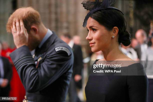 Prince Harry, Duke of Sussex and his wife Meghan, Duchess of Sussex atend a service to commemorate The Royal Air Force's 100th Birthday at...