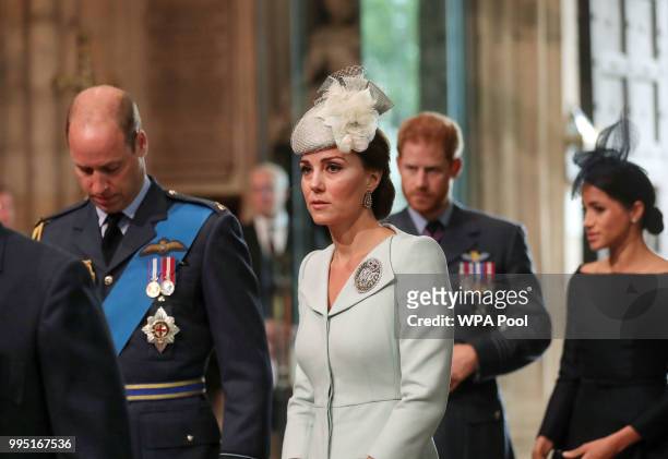 Prince William, Duke of Cambridge, Catherine, Duchess of Cambridge, Prince Harry, Duke of Sussex and his wife Meghan, Duchess of Sussex arrive for a...