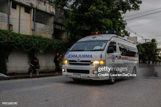 An ambulance transports rescued boys from a helipad to Chiangrai Prachanukroh Hospital on July 10, 2018 in Chiang Rai, Thailand. Divers began an...