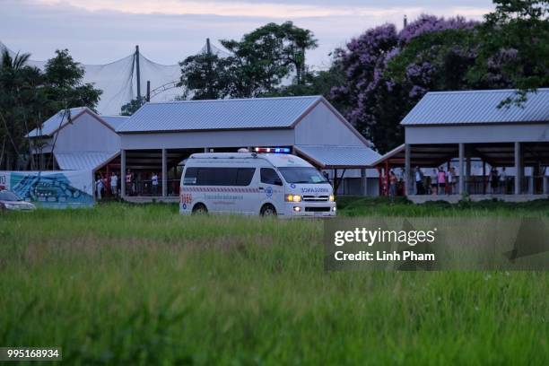 Ambulances transport boys rescued from Tham Luang Nang Non cave from a helipad to Chiangrai Prachanukroh Hospital on July 10, 2018 in Chiang Rai,...