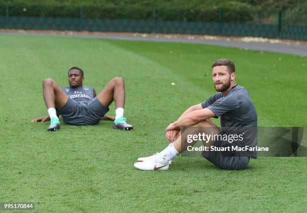 Chuba Akpom and Shkodran Mustafi of Arsenal after a training session at London Colney on July 10, 2018 in St Albans, England.