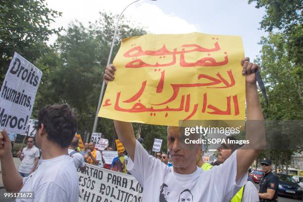 Man seen holding a poster during the protest. Members of the Hirak movement in Madrid protest demanding the release of the political prisoners of the...