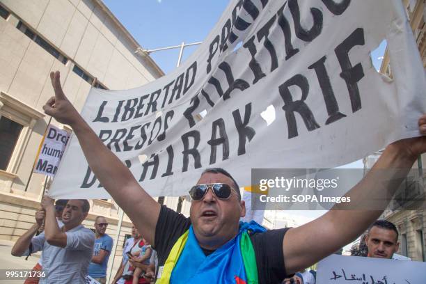 Man seen holding a banner during the protest. Members of the Hirak movement in Madrid protest demanding the release of the political prisoners of the...