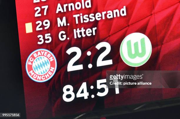 The display panel shows the score "2-2" during the German Bundesliga soccer match between Bayern Munich and VfL Wolfsburg in the Allianz Arena in...