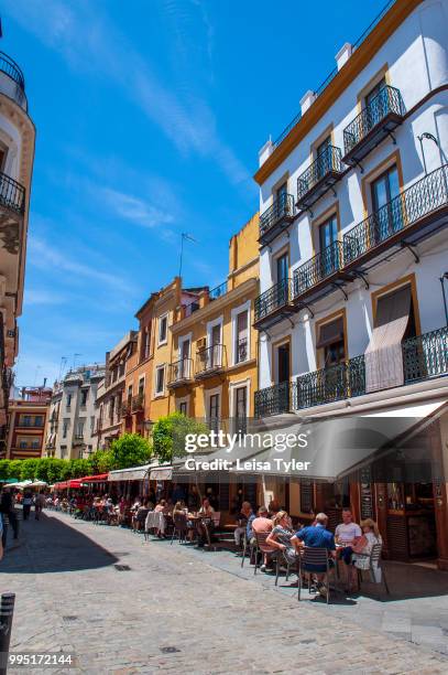 Cafe's spilling out onto the street in Seville, Spain.