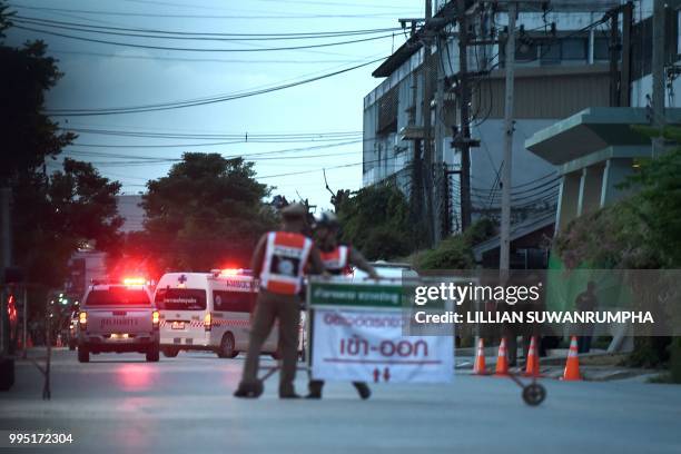 An ambulance transporting alleged members of the children's football team approaches the hospital in the northern Thai city of Chiang Rai on July 10,...