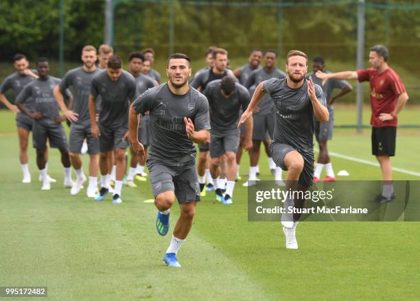 Sead Kolasinac and Shkodran Mustafi of Arsenal during a training session at London Colney on July 10, 2018 in St Albans, England.