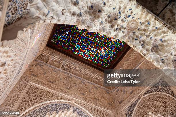 The ceiling of the Mirador de Daraxa at the Alhambra, a 13th century Moorish palace complex in Granada, Spain. Built on Roman ruins, the Alhambra was...