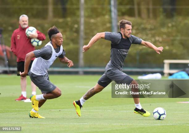 Pierre-Emerick Aubameyang and Aaron Ramsey of Arsenal during a training session at London Colney on July 10, 2018 in St Albans, England.